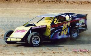 Awesome Black dirt modified race car action shot